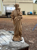 Handmade solid plaster outdoor statue base with ornate scrollwork detail, shown with St Joseph statue